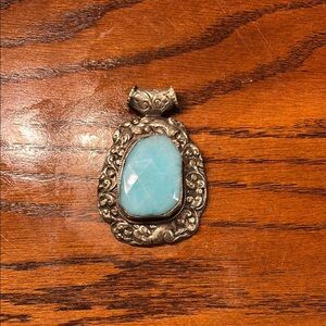 Elegant Silver Pendant with Blue Stone